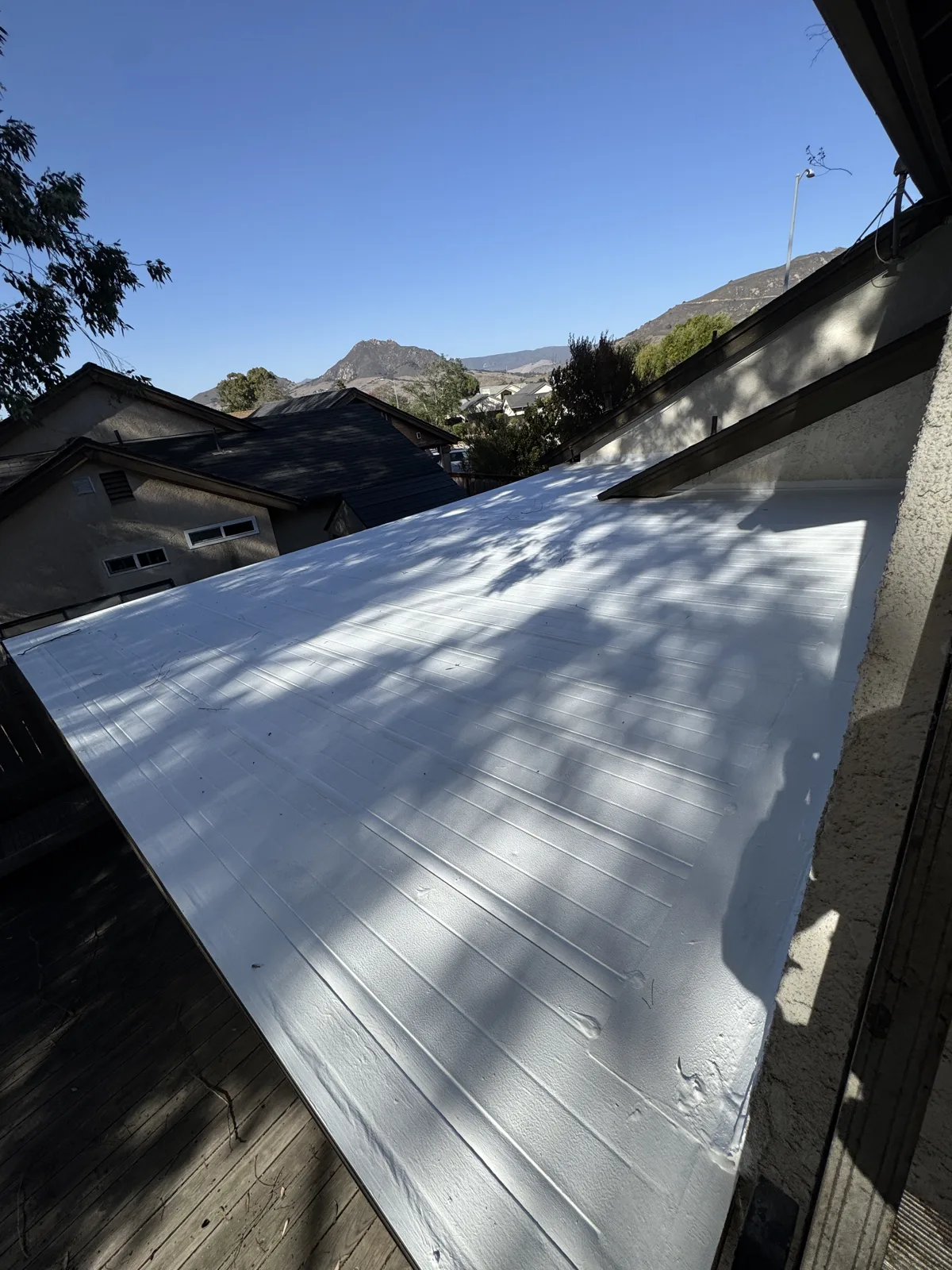 Finished acrylic roof coating on an attached sunroom roof in the San Luis Obispo area