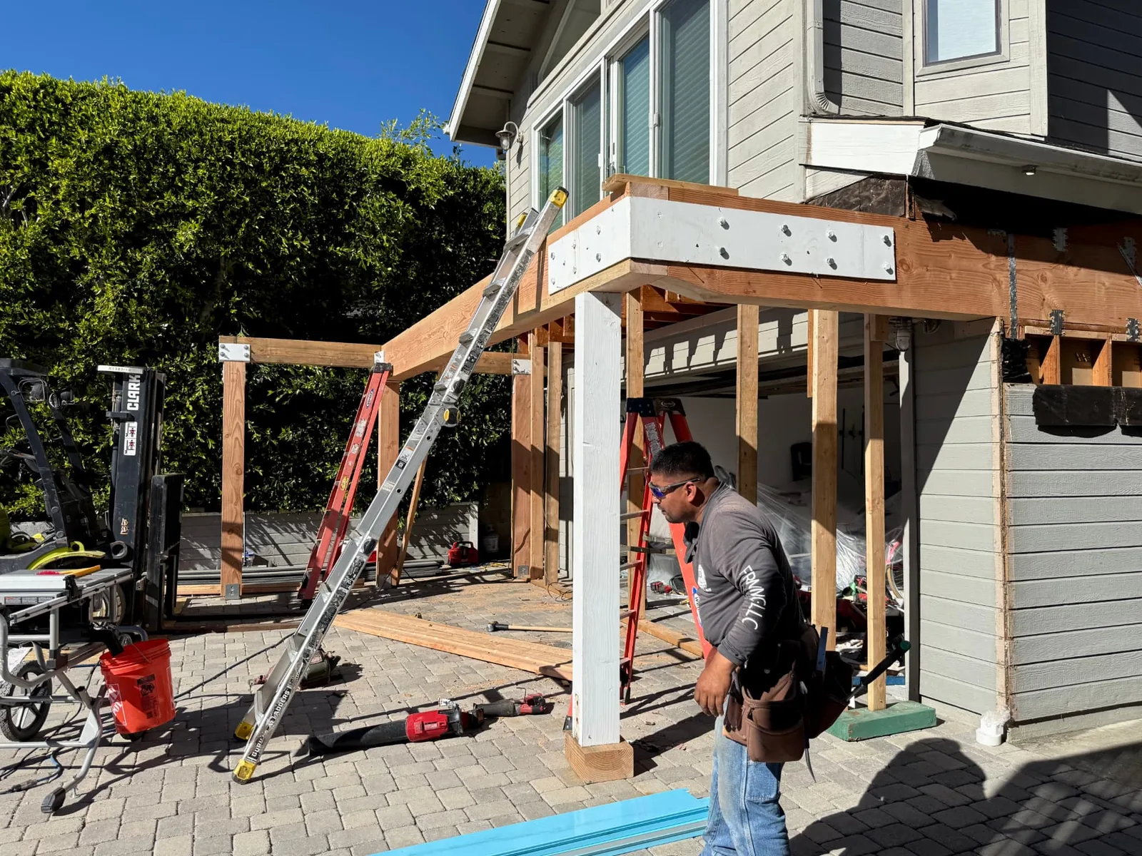 Structural beams and steel connection hardware during a deck build in Santa Barbara