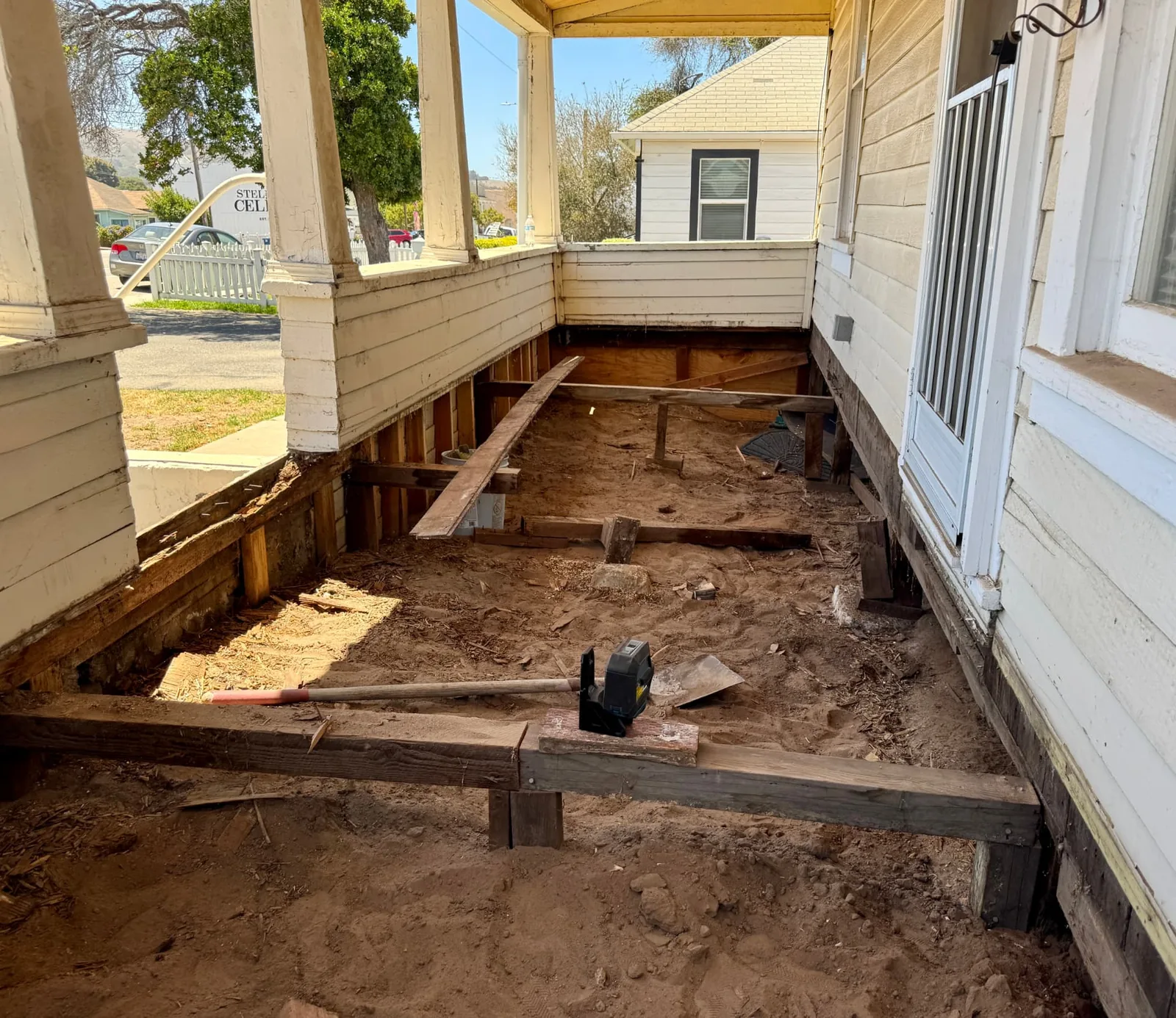 Old porch decking removed down to the framing during a tear-off in Santa Maria