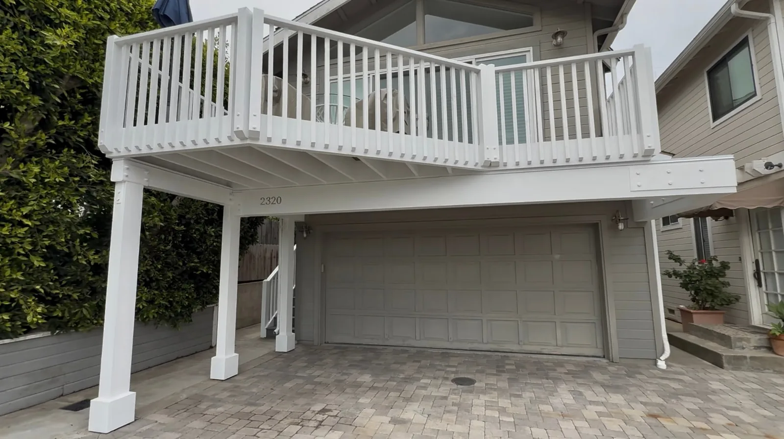 Completed white deck railing and columns on a second-story deck build in Santa Barbara