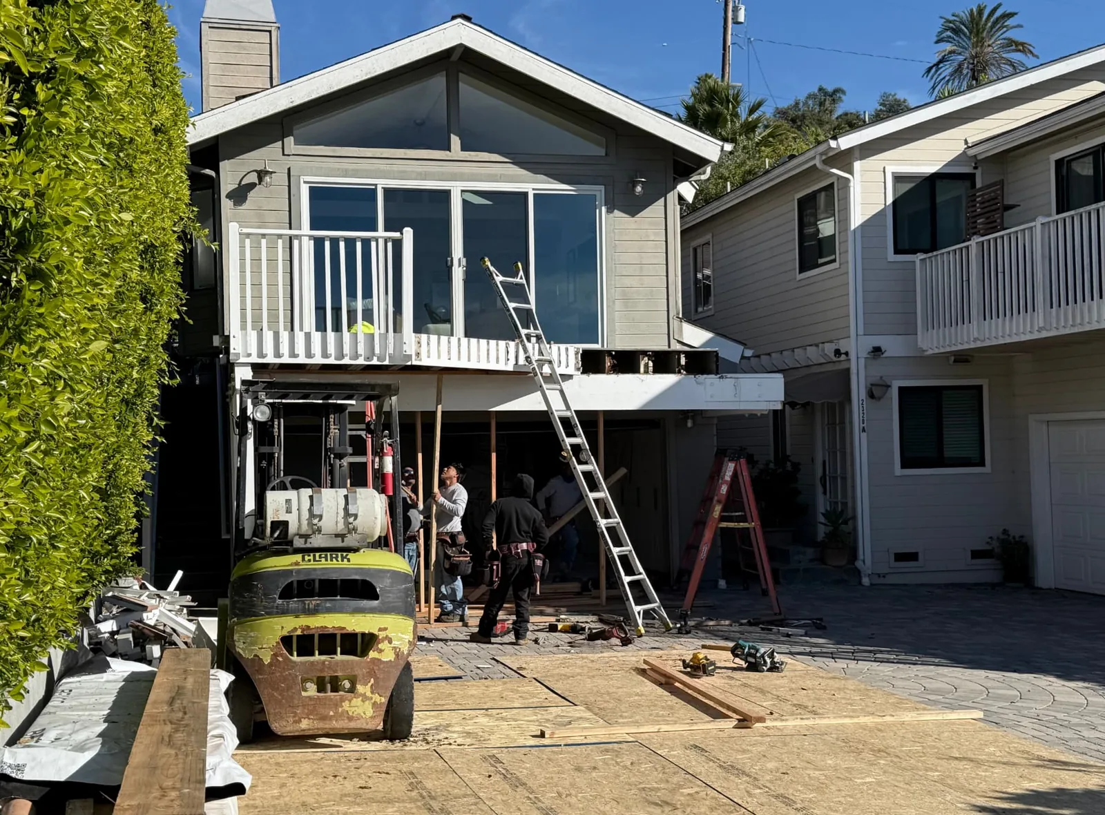 Crew framing a second-story deck over a garage in Santa Barbara