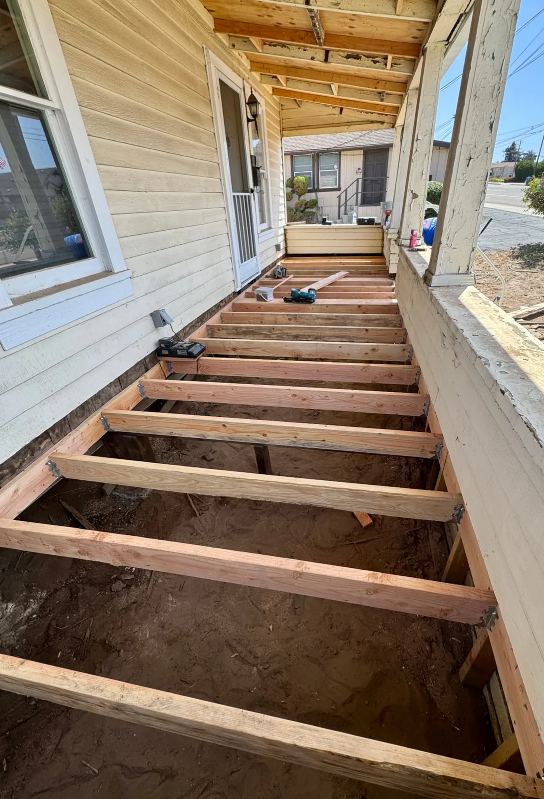 New pressure-treated framing installed on a porch rebuild in Santa Maria